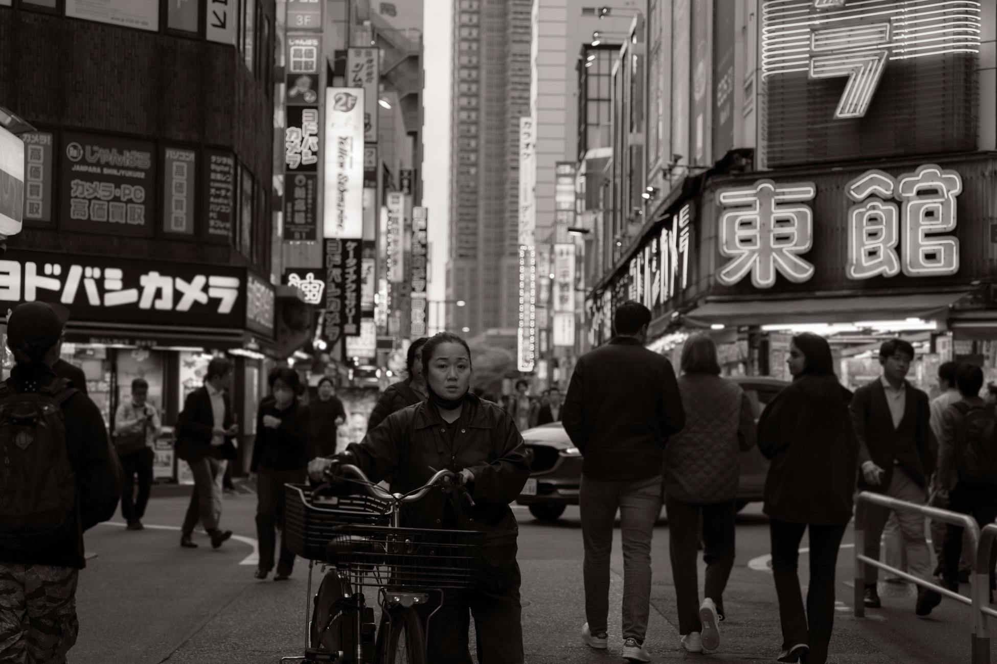 A bustling Tokyo street scene with neon signs and diverse pedestrians.