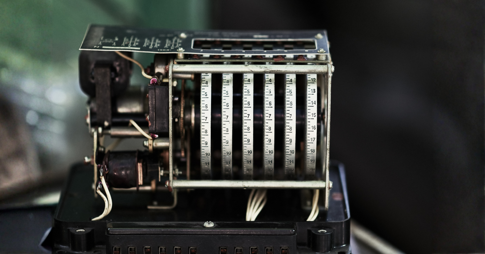 In 1944, an IBM machine called the Harvard Mark I clattered through a calculation for the Manhattan Project at three additions per second, fed by paper tape and operated by a young Navy lieutenant named Grace Hopper who took the graveyard shift more often than anyone and slept beside it on a cot, waking the moment the relays went quiet because a silent machine meant something had gone wrong